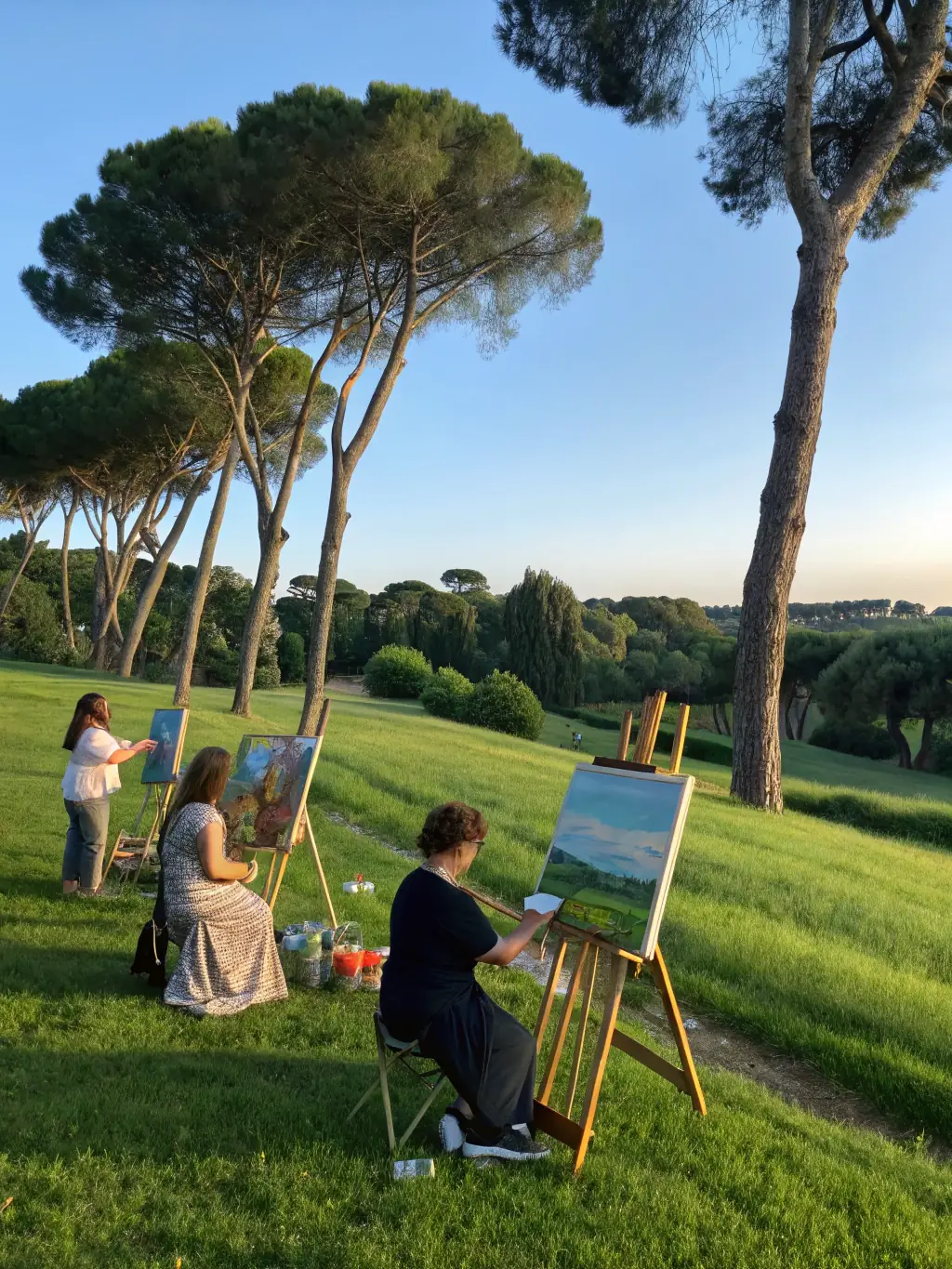 A vibrant photograph capturing a diverse group of people actively participating in an art workshop, showcasing the inclusive environment fostered by ASSOCIATION ATELIER 15.